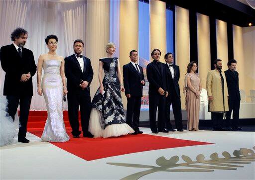 From left, Tim Burton, Kristin Scott Thomas, Russell Crowe, Cate Blanchett, Emmaunel Carrere, Alexandre Desplat, Benicio Del Toro, Giovanna Mezzogiorno, Shekhar Kapur and Victor Erice during the Opening Ceremony, at the 63rd international film festival, in Cannes