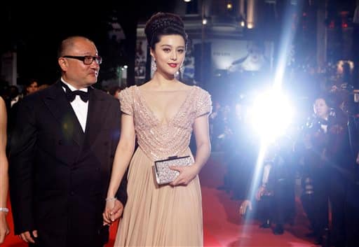 Director Wang Xiaoshuai and actress Fan Bingbing arrive for the screening of 