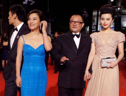 Director Wang Xiaoshuai, center, actress Fan Bingbing, right, and an unidentified guest arrive for the screening of 