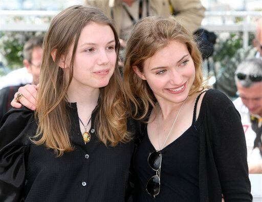 Actors Imogen Poots, right, and Hannah Murray, left, pose during a photo call for 