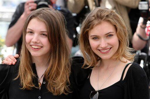 Actors Imogen Poots, right, and Hannah Murray, left, pose during a photo call for 