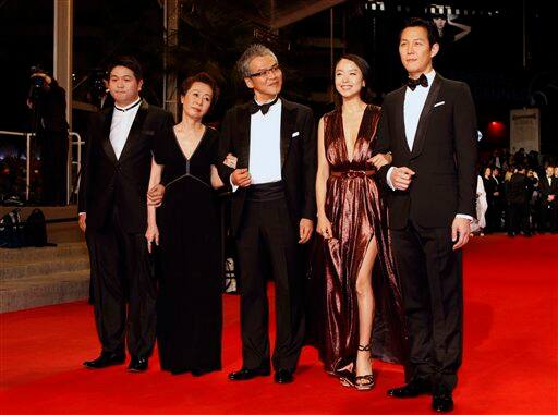 From left, actor Jason Chae, actress Youn Yuh-jung, director Im Sang-soo, actress Jeon Do-yeon and actor Lee Jung-jae arrive for the screening of 