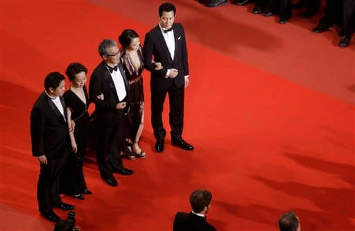 From left, actor Jason Chae, actress Youn Yuh-jung, actor Lee Jung-jae, actress Jeon Do-yeon, and actor Lee Jung-jae, arrive for the screening of 