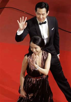 Actor Lee Jung-jae, top, and actress Jeon Do-yeon, bottom, for the screening of 