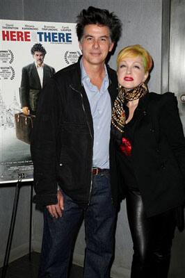 In this photo released by Starpix, actor David Thorton, left, poses with wife, singer Cindi Lauper, at the New York premiere of their film 