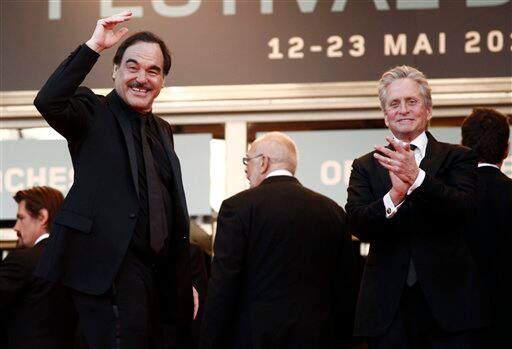 Director Oliver Stone, left, and actor Michael Douglas arrive for the screening of 