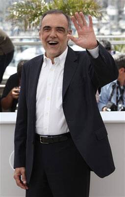 Italian Museum of Cinema director and jury member Alberto Barbera gestures for photographers during a photo call for the Jury, at the 63rd international film festival, in Cannes