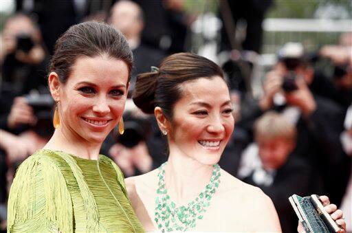 Actresses Evangeline Lilly, left, and Michelle Yeoh arrive for the premiere of 