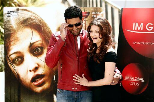 Actor Abhishek Bachchanm, left, and actress Aishwarya Rai pose during a photo call for 