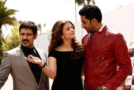 From left, actor Vikram, actress Aishwarya Rai and Abhishek Bachchan pose during a photo call for 