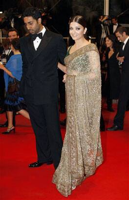 Actress Aishwarya Rai, right, and actor Abhishek Bachchan arrive for the screening of 