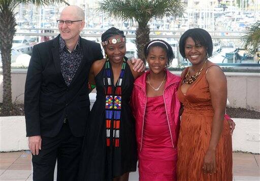 From left, director Oliver Schmitz and actresses Lerato Mvelase, Khomotso Manyaka and Harriet Manamela pose during a photo call for the film 