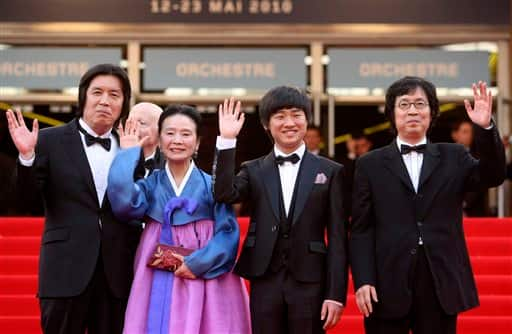 From left, filmmaker Lee Changdong, actress Yun Junghee, actor Lee David, and producer Lee Joondong, arrive for the screening of the film 