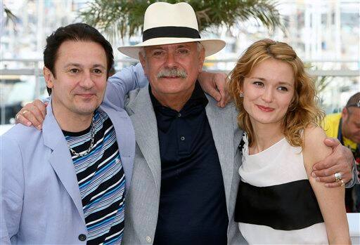 Actor Oleg Menshikov, left, director Nikita Mikhalkov, center, actress Nadezhda Mikhalkova, right, poses during a photo call for 