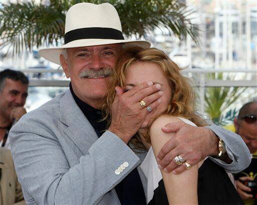 Director Nikita Mikhalkov, left, and actress Nadezhda Mikhalkova, right, pose during a photo call for 