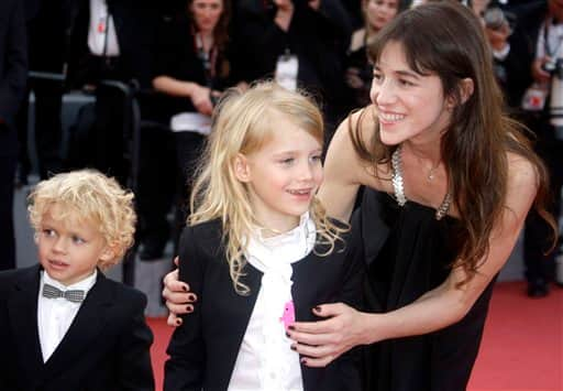 Actress Charlotte Gainsbourg, right, and actress Morgana Davies, center, and an unidentified child arrive for the awards ceremony at the 63rd international film festival, in Cannes