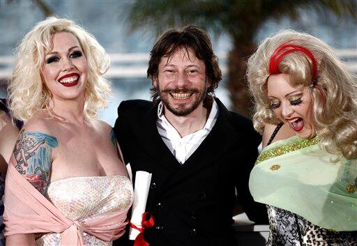 Winner of the award for Best Director director Mathieu Amalric, center, and actresses, Mimi Le Meux, left, and Dirty Martini, right, pose after the awards ceremony at the 63rd international film festival, in Cannes