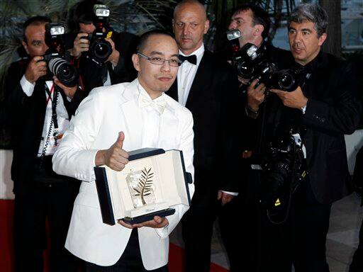 Winner of the award for Best Screenplay director Apichatpong Weerasethakul poses after the awards ceremony at the 63rd international film festival, in Cannes