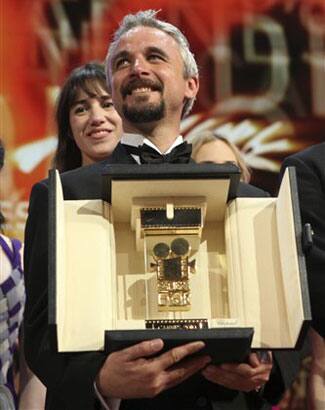 Camera d'Or award winner Michael Rowe poses for photographers during the awards ceremony at the 63rd international film festival, in Cannes