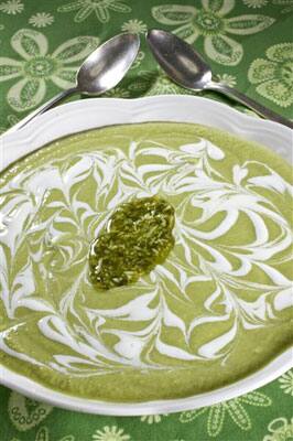 Chilled zucchini and green bean soup with a pesto swirl. Don't let the heat of the summer keep you from enjoying a nutritious and filling bowl of soup.