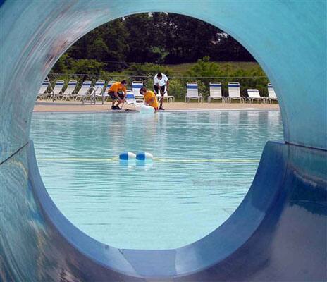 Employees put the finishing touches on the swimming pool at Paradise Breeze Water Park near Maysville, Ky.