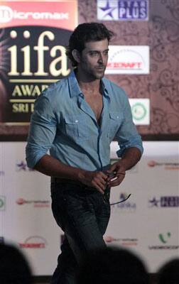 Bollywood actors Hrithik Roshan walks during a press conference organized by the International Indian Film Association (IIFA), in Mumbai, India