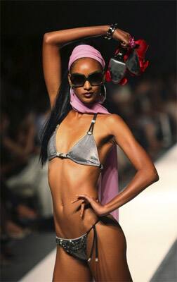 A model presents a creation from Claudia Pegus` collection on the night of Cutting Edge Caribbean during Trinidad and Tobago Fashion Week in Port of Spain.