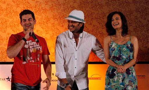 Bollywood actors Neil Nitin Mukesh, left, Ritesh Deshmukh, center, and Dia Mirza share a light moment during a media briefing in Colombo, Sri Lanka.