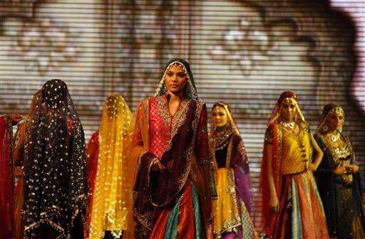 Indian models show case designs during a fashion show as part of the three-day long International Indian Film Academy (IIFA) awards in Colombo, Sri Lanka.