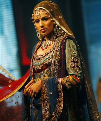 An Indian model showcases a costume during a fashion show as part of the three-day long International Indian Film Academy (IIFA) awards in Colombo, Sri Lanka.