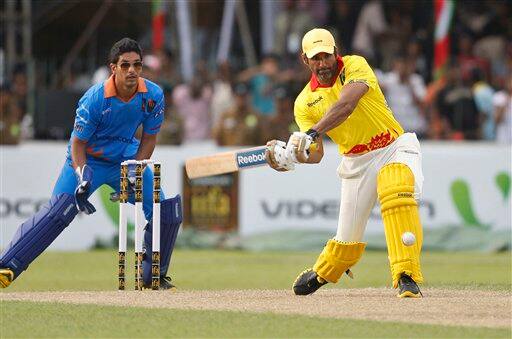 Bollywood actors Sunil Shetty bats during a charity cricket match between IFFA XI and Sangakkara's XI as part of the three-day long International Indian Film Academy (IIFA) awards in Colombo, Sri Lanka, Friday, June 4, 2010.