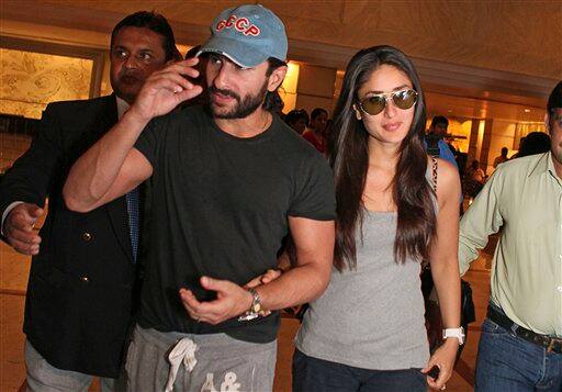 Bollywood actors Saif Ali Khan, left, and Kareena Kapoor arrive at a hotel lobby in Colombo, Sri Lanka, Friday, June 04, 2010. 