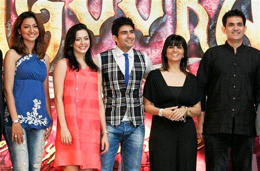 Bollywood actors, from left, Gauahar Khan, Isha Sharvani, Hussain Kuwajerwala, with fashion designer Neeta lulla, second right, and art director Omung Kumar pose for a photographers during a press conference to announce the Bollywood musical 