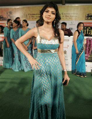 Sherlyn Chopra poses as she arrives at the International Indian Film Academy, or IIFA, awards event in Colombo