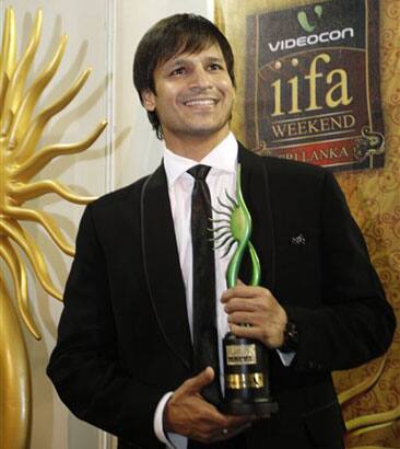 Vivek Oberoi poses for photographers while holding the IIFA Global Green Award during the International Indian Film Academy Awards in Colombo