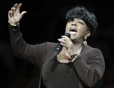 Anita Baker performs the national anthem before Game 4 of the NBA basketball finals between the Boston Celtics and the Los Angeles Lakers.