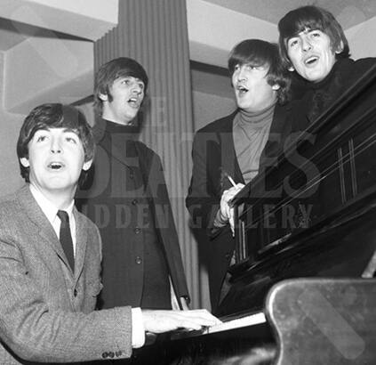 Paul plays the piano as Ringo, John and George join the spirit of the moment.