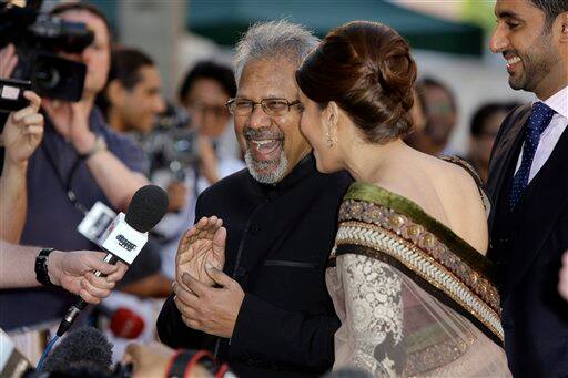 Indian director Mani Ratnam, centre left, reacts with Indian actress Aishwarya Rai Bachchan, on the red carpet for the World Premiere of the film Raavan, at the BFI, British Film Institute, in London.