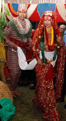 Manisha Koirala, right, and groom Samrat Dahal perform rituals at a resort just outside Katmandu, Nepal. Koirala married Nepalese businessman Dahal in a traditional ceremony attended by family and close friends.