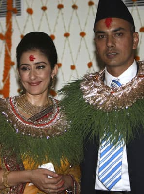 Manisha Koirala poses with her groom Samrat Dahal during their wedding ceremony in Kathmandu on June 18. Koirala's wedding with her businessman fiance was attended by hundreds of relatives and fellow actors.