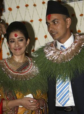 Dressed in a yellow saree, Manisha garlanded Samrat and exchanged wedding rings as priests recited Vedic mantras in the presence of her father Prakash Koirala and mother Sushma. 