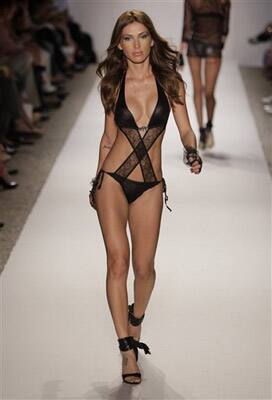 A model walks down the runway during the Beach Bunny Swimwear 2011 collection show at the Mercedes-Benz Fashion Week Swim in Miami Beach, Fla.