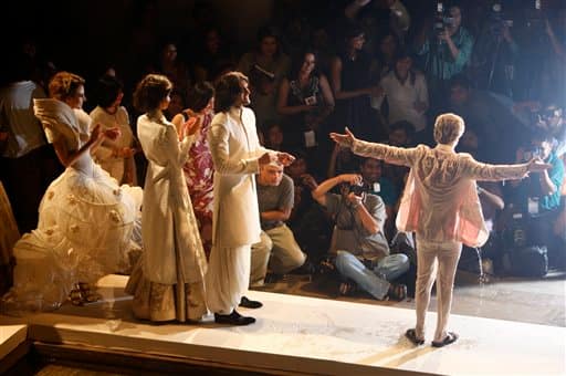 Models display creations by Indian designer Rohit Bal, right, at the Pearls Delhi Couture Week 2010 in New Delhi, India.