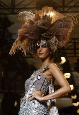 A model displays a creation by Indian designer Manav Gangwani, at the Pearls Delhi Couture Week 2010 in New Delhi, India.