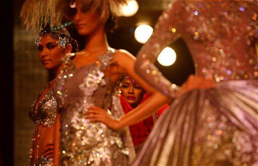 Models display creations by Indian designer Manav Gangwani at the Pearls Infrastructure Delhi Couture Week 2010 in New Delhi, India.