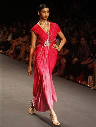 A model displays a creation by Indian designer Raakesh Agarvwal at the Pearls Infrastructure Delhi Couture Week 2010 in New Delhi, India.