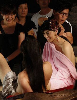 Japanese adult actress Saori Hara (R) and actor Hayama Hiro (L) take a break during a rehearsal of an erotic scene of 