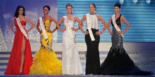 Miss U.S.A. Alexandria Mills, center, Miss Venezuela Adriana Vasini, left, Miss Botswana Emma Wareus, second left, Miss Ireland Emma Waldron, second right, and Miss China Tang Xiao, right, stand together as the five finalists during the 2010 Miss World pageant contest in Sanya.