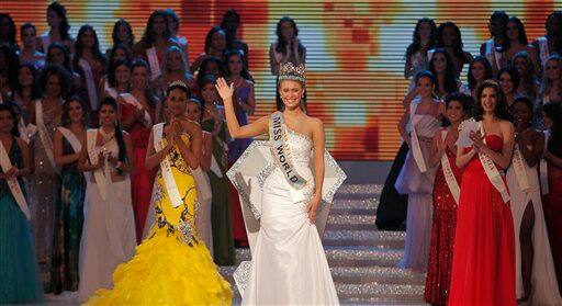 Alexandria Mills of U.S.A., front center, gestures after being crowned winner of the 2010 Miss World pageant contest at the Beauty Crown Cultural Center in Sanya.