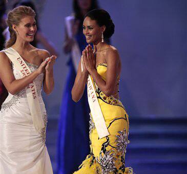 Miss Botswana Emma Wareus, right, gestures beside Alexandria Mills of U.S.A., left, after being announced 2nd place at 2010 Miss World pageant contest at the Beauty Crown Cultural Center in Sanya.